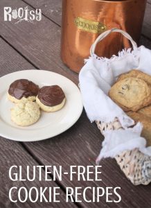 Gluten free cookies on a plate and in a basket in front of a copper cookie jar.