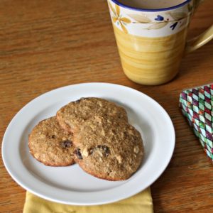 Oatmeal Raisin Breakfast Cookies on a plate with a cup of coffee.