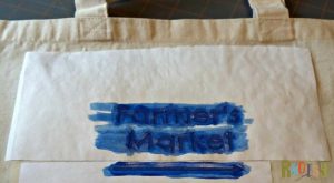 Put a creative spin on reusable canvas grocery bags with this easy freezer paper stencil tutorial. Customize your bags however you would like, the sky's the limit. | Rootsy.org
