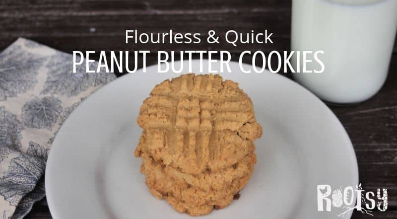 Flourless peanut butter cookies stacked on a plate with text overlay.