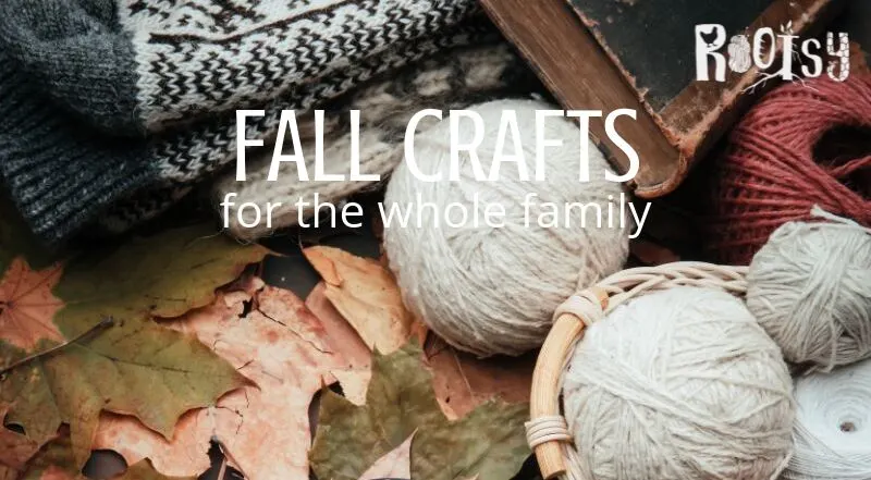 Balls of yarn sitting on top of fall leaves with text overlay.