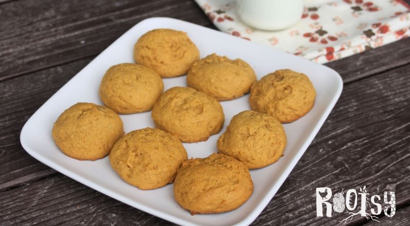 Pumpkin cookies on a square white platter.