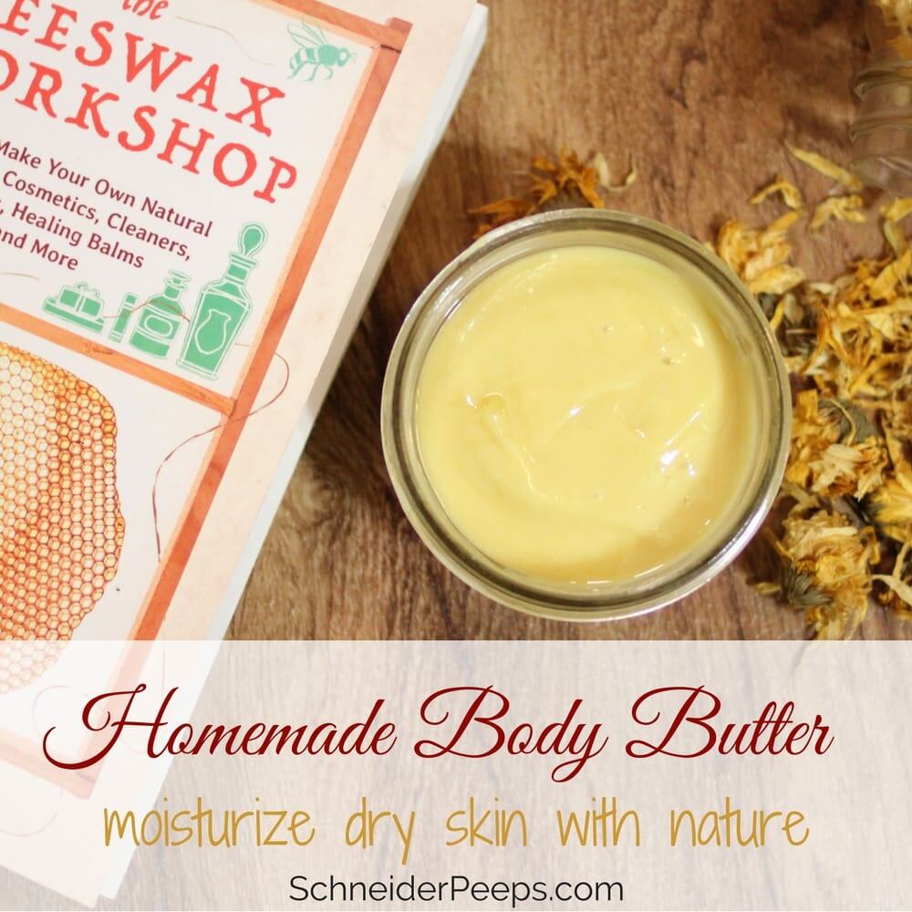 A jar of homemade body butter sits on a wooden surface, surrounded by dried flowers. A book titled "The Beeswax Workshop" peeks into view. Text reads: "Homemade Body Butter - gifts in a jar to moisturize dry skin with nature.