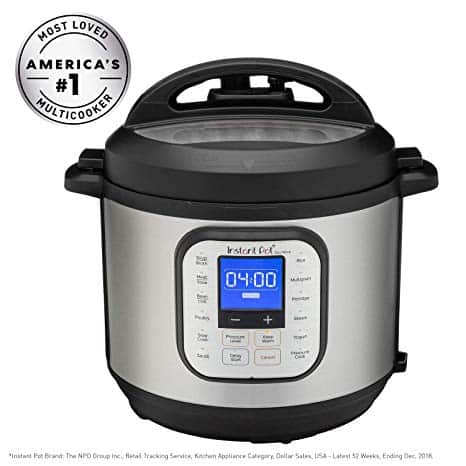 A black and stainless steel multicooker with a digital display showing "04:00" and various function buttons. The lid is closed, and it is labeled "America's #1 Multicooker" and "Most Loved.