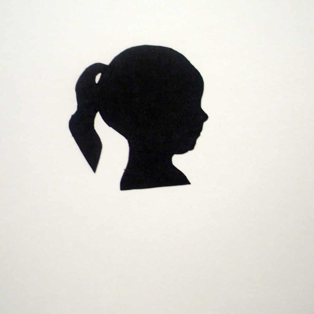 Silhouette of a person's profile on a plain background. The figure has a ponytail, and their profile is visible with distinct neck and face outlines.