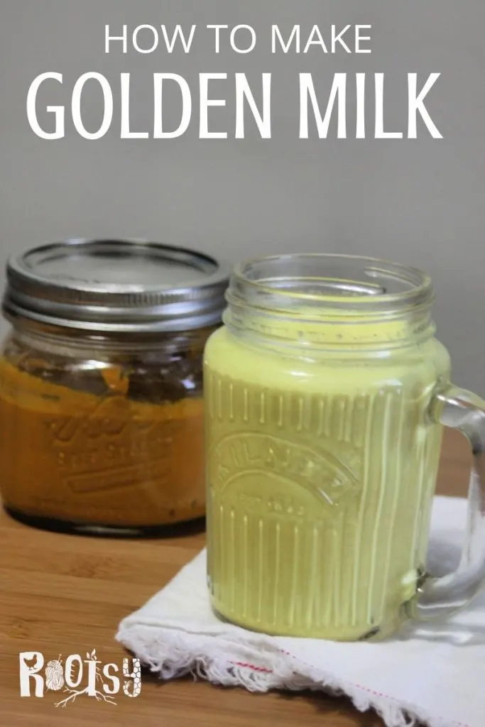 A glass mug of golden milk tea sitting on a white napkin with a jar of golden milk paste sitting behind it and text overlay. 