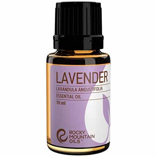A small amber bottle of Rocky Mountain Oils Lavender Essential Oil, labeled as "Lavandula Angustifolia," is perfect for enhancing your DIY bath bombs. The label features shades of purple, white, and black text, with a volume of 15 ml indicated.