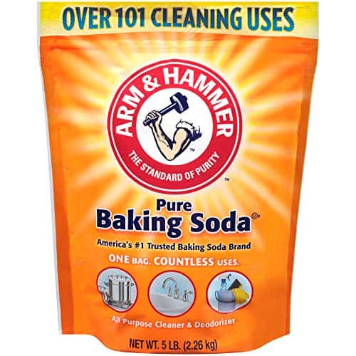 A 5-pound bag of Arm & Hammer Pure Baking Soda featuring the iconic hammer logo and text promoting "over 101 cleaning uses," including making bath bombs. The package includes images illustrating various household applications.