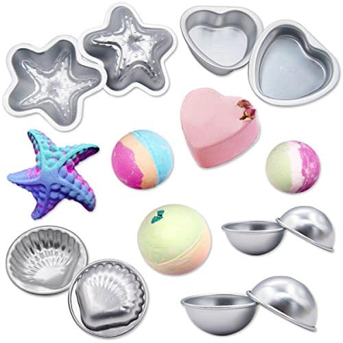 Various metal molds in star, heart, and round shapes are displayed with vibrant bath bombs, featuring delightful starfish, heart, and spherical designs.