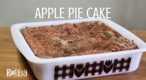 Apple pie cake in a white square cake plan with text overlay.