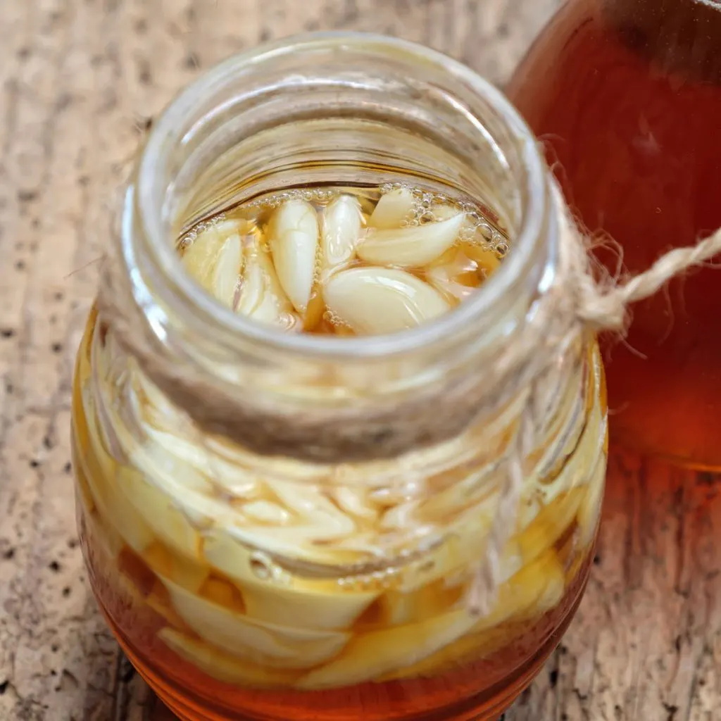 Garlic cloves in a jar of honey.