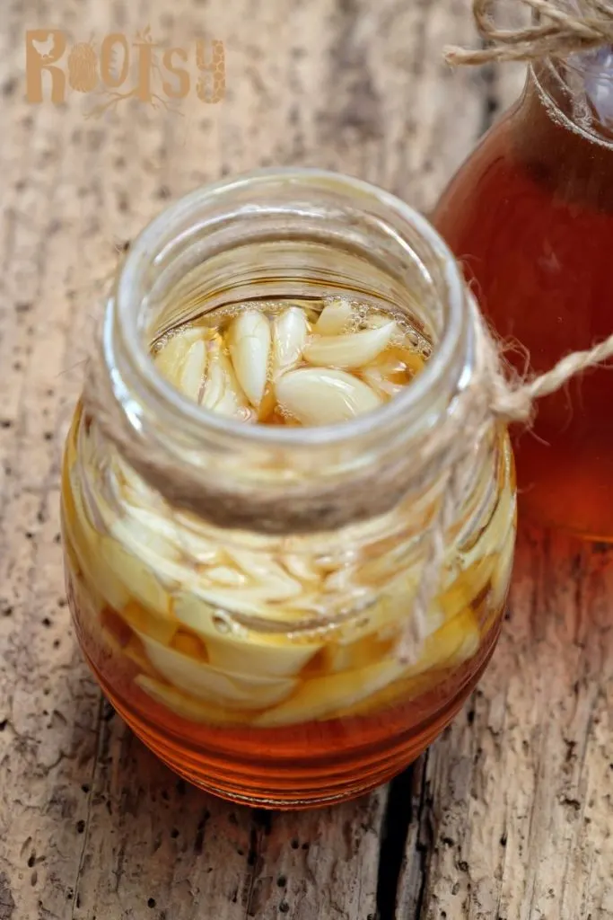 A jar of garlic cloves submerged in honey.