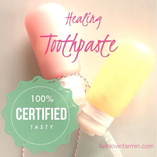 Two pastel-colored bottles labeled "Healing Toothpaste" offer a touch of elegance to any money-saving bathroom. A decorative green badge proudly states "100% CERTIFIED TASTY." Discover more at livinlovinfarmin.com.