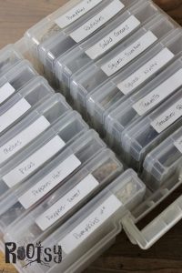 photo organizing boxes filled with seed packets for storage