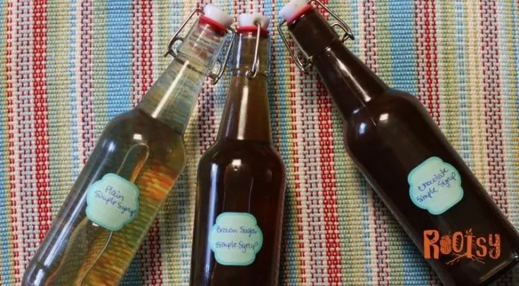 three simple syrups in bottles - plain, brown sugar, and chocolate