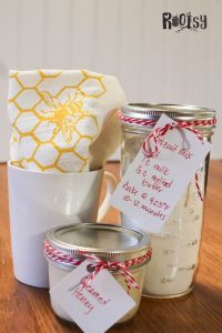 get set of creamed honey with biscuit mix in a jar and a mug with a tea towel