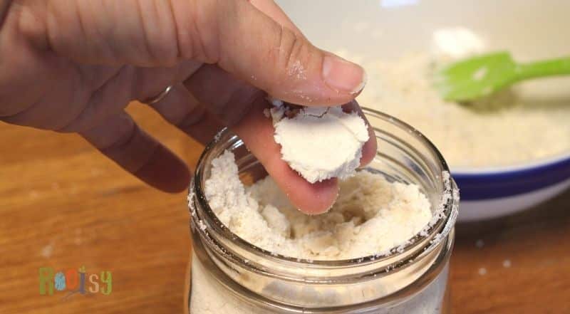 mason jar of homemade baking mix showing how the flour sticks together