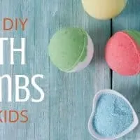 colorful bath bombs for kids on a blue wooden background