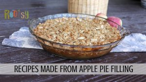 A glass pie plate with apple crisp sitting on napkin. Text overlay reads: Recipes made from apple pie filling.