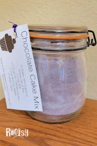 A jar filled with cake mix and labeled with chocolate cake mix baking instructions.