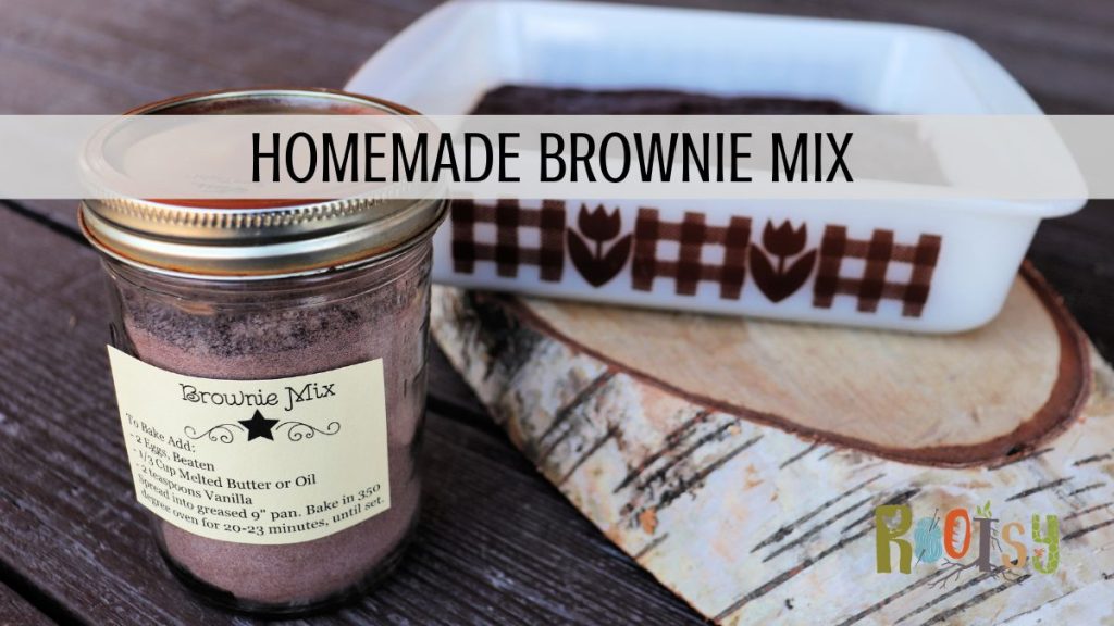 A labeled jar of brownie mix sit in front of a pan of baked brownies. Text overlay reads: Homemade brownie mix.